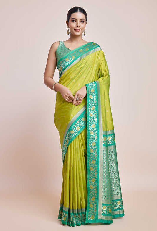 Monjolika Fashion Parrot Green Banarasi Silk In Satin Is Classy Embellished With Golden Zari Work Saree