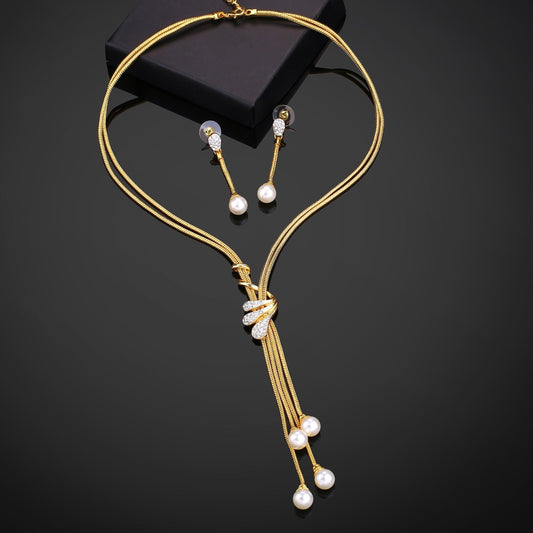 Estele Gold-Polished Trendy Tassel Necklace set with White Pearls for Women - Swadesiicart