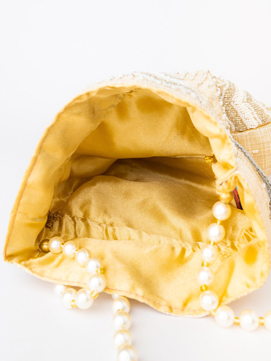 NR By Nidhi Rathi Cream-Coloured & Gold-Toned Embellished Potli Clutch - Grab2buy