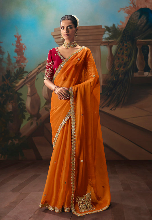 Monjolika Fashion Orange Fancy Fabric Saree With Embroidered Work