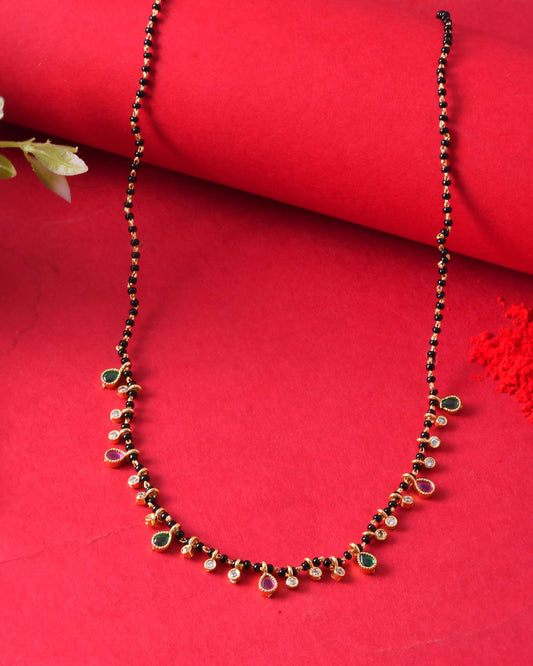 Jewels Nest Elegant Black Beads Mangalsutra with Green & Red Stone Drops – Silver Finish