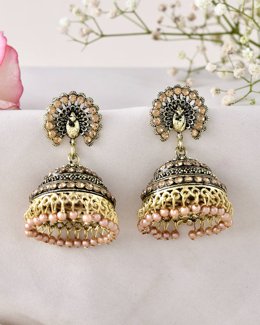 Jewels Nest Antique Gold-Polished Jhumka Earrings with Floral Detailing and Stone Embellishments Jewels Nest