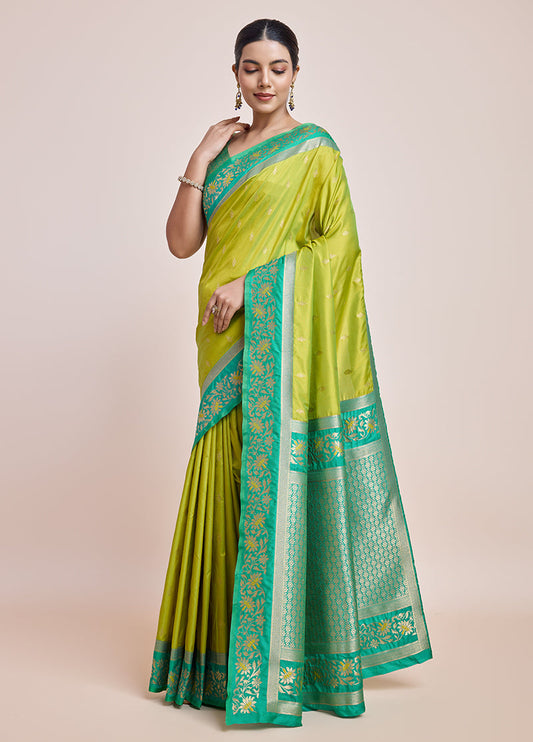 Monjolika Fashion Parrot Green Banarasi Silk In Satin Is Classy Embellished With Golden Zari Work Saree