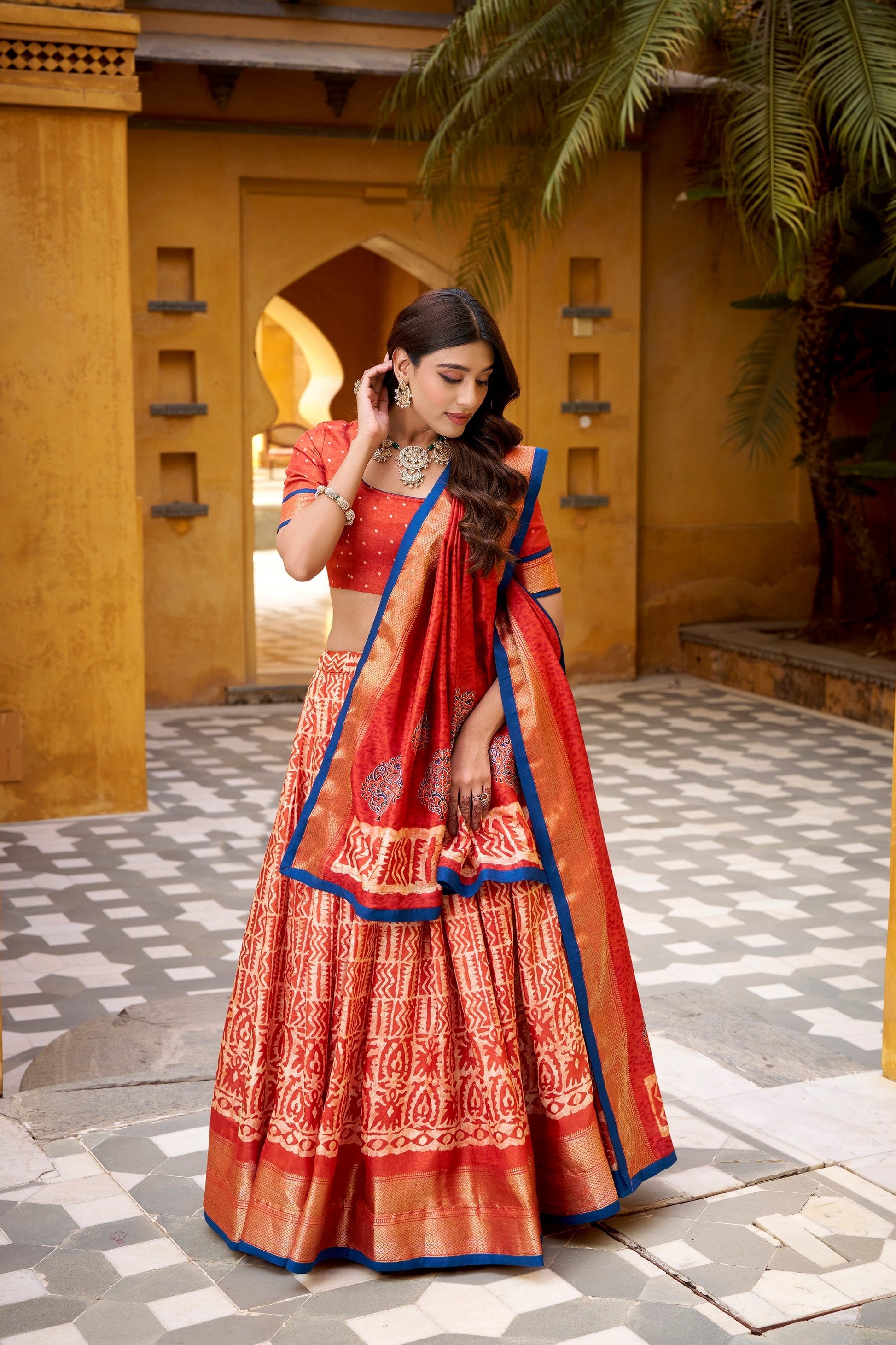 Lorenvalley Fashion Rust Dola Silk Batik Print with Zari Weaving Work Lehenga Choli with Dupatta 