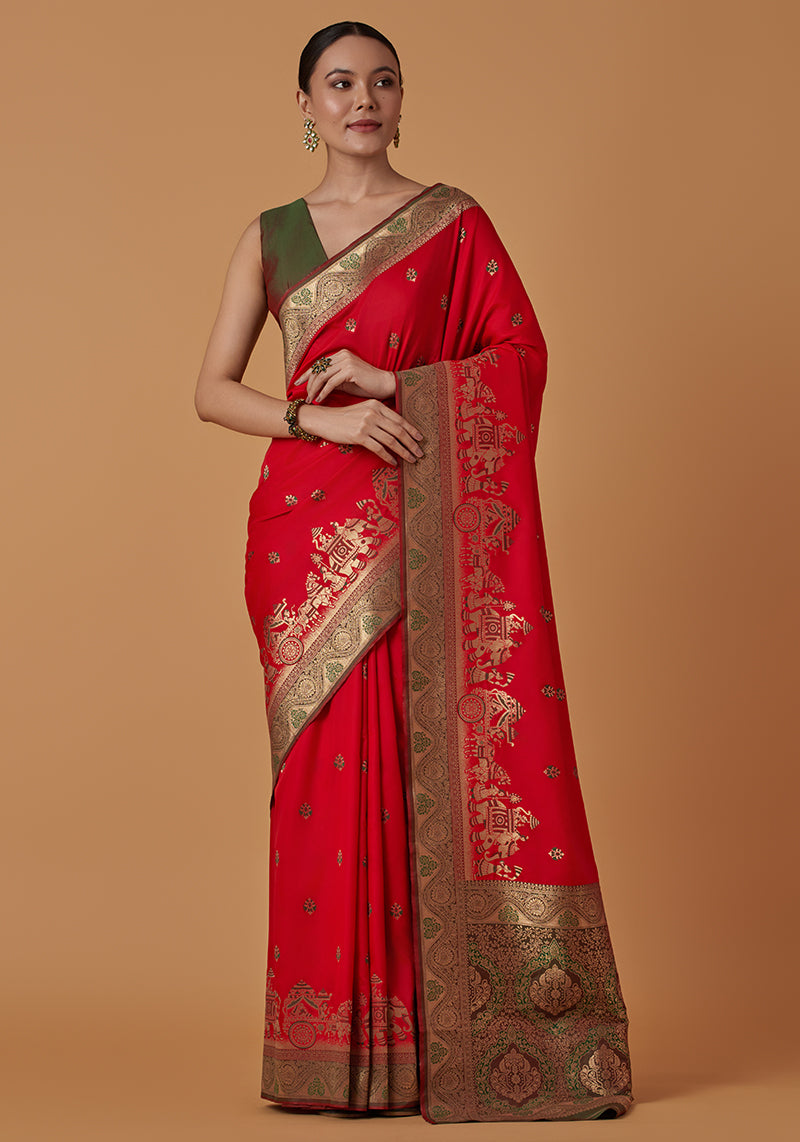 Monjolika Fashion Red Banarasi Silk Blend SareeWith Traditional & Modern Dulha Dulhan Figure Zari Woven Detailing 