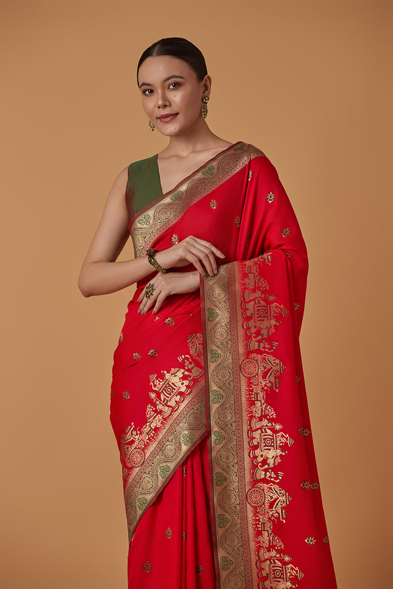 Monjolika Fashion Red Banarasi Silk Blend SareeWith Traditional & Modern Dulha Dulhan Figure Zari Woven Detailing 