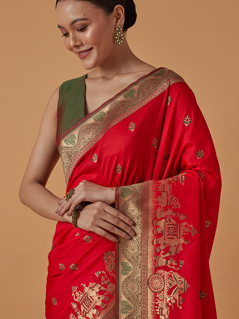 Monjolika Fashion Red Banarasi Silk Blend SareeWith Traditional & Modern Dulha Dulhan Figure Zari Woven Detailing 