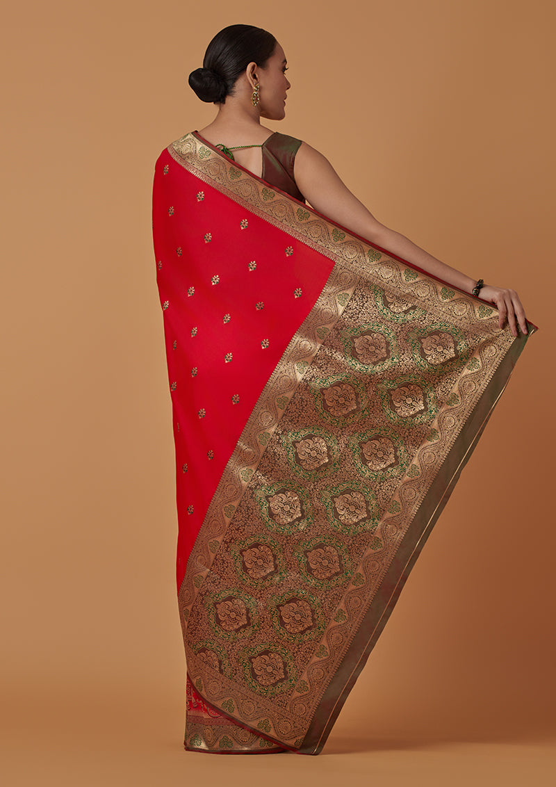 Monjolika Fashion Red Banarasi Silk Blend SareeWith Traditional & Modern Dulha Dulhan Figure Zari Woven Detailing 