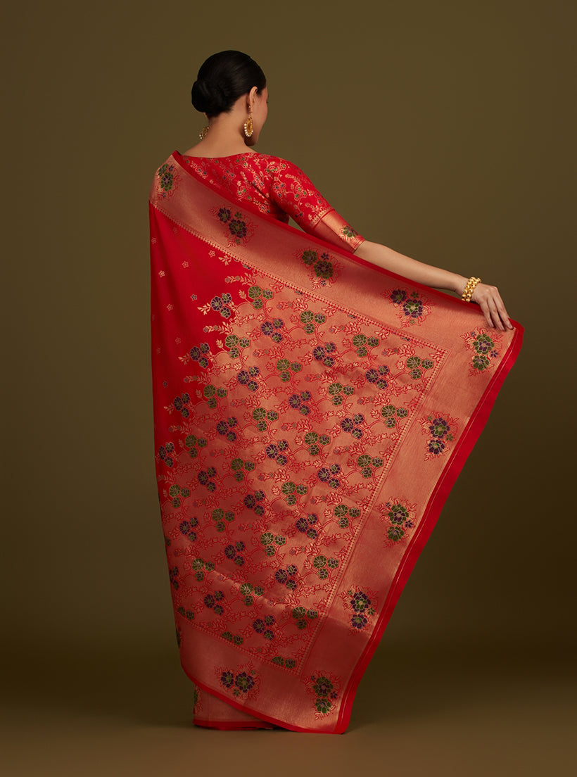 Monjolika Fashion Red Woven Silk Blend SareeWith Zari Work & Floral Motifs