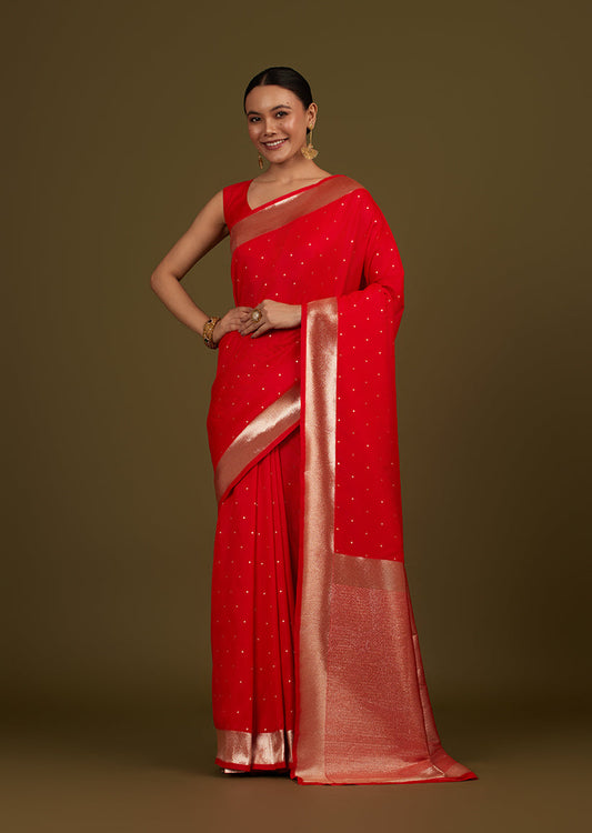 Monjolika Fashion Red Woven Silk Blend SareeWith Zari Work & Floral Motifs