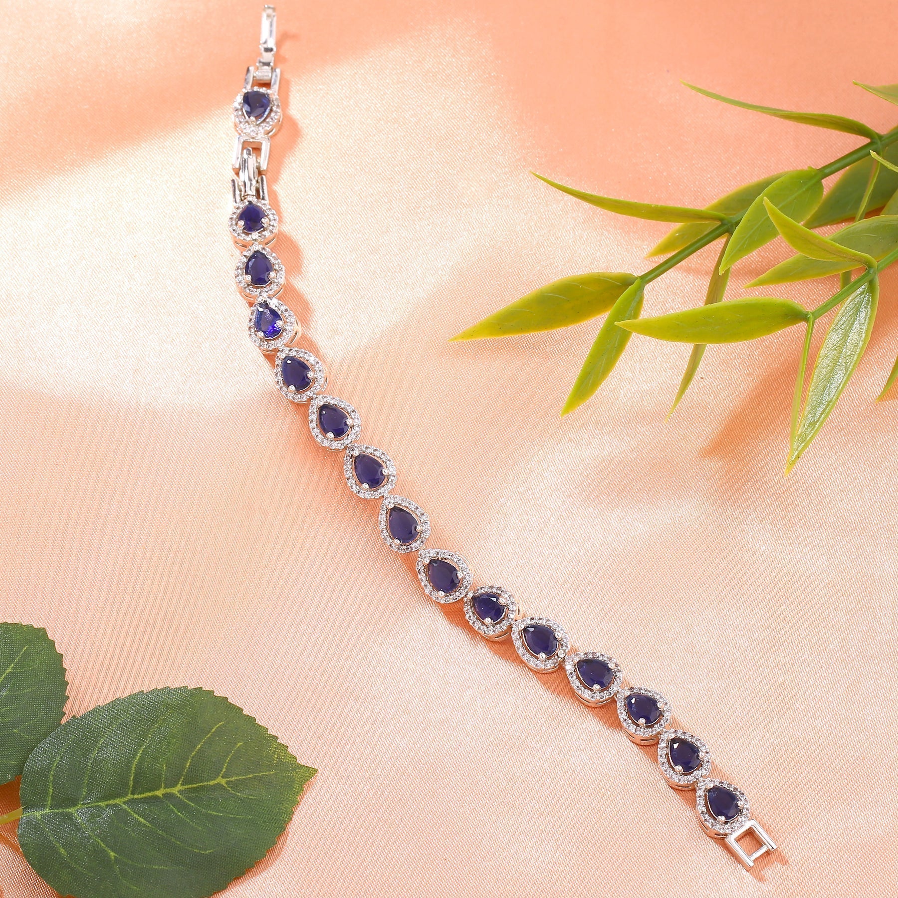 Estele Rhodium Plated CZ Drop Designer Charm Bracelet with Blue American Diamonds for Women - Swadesiicart