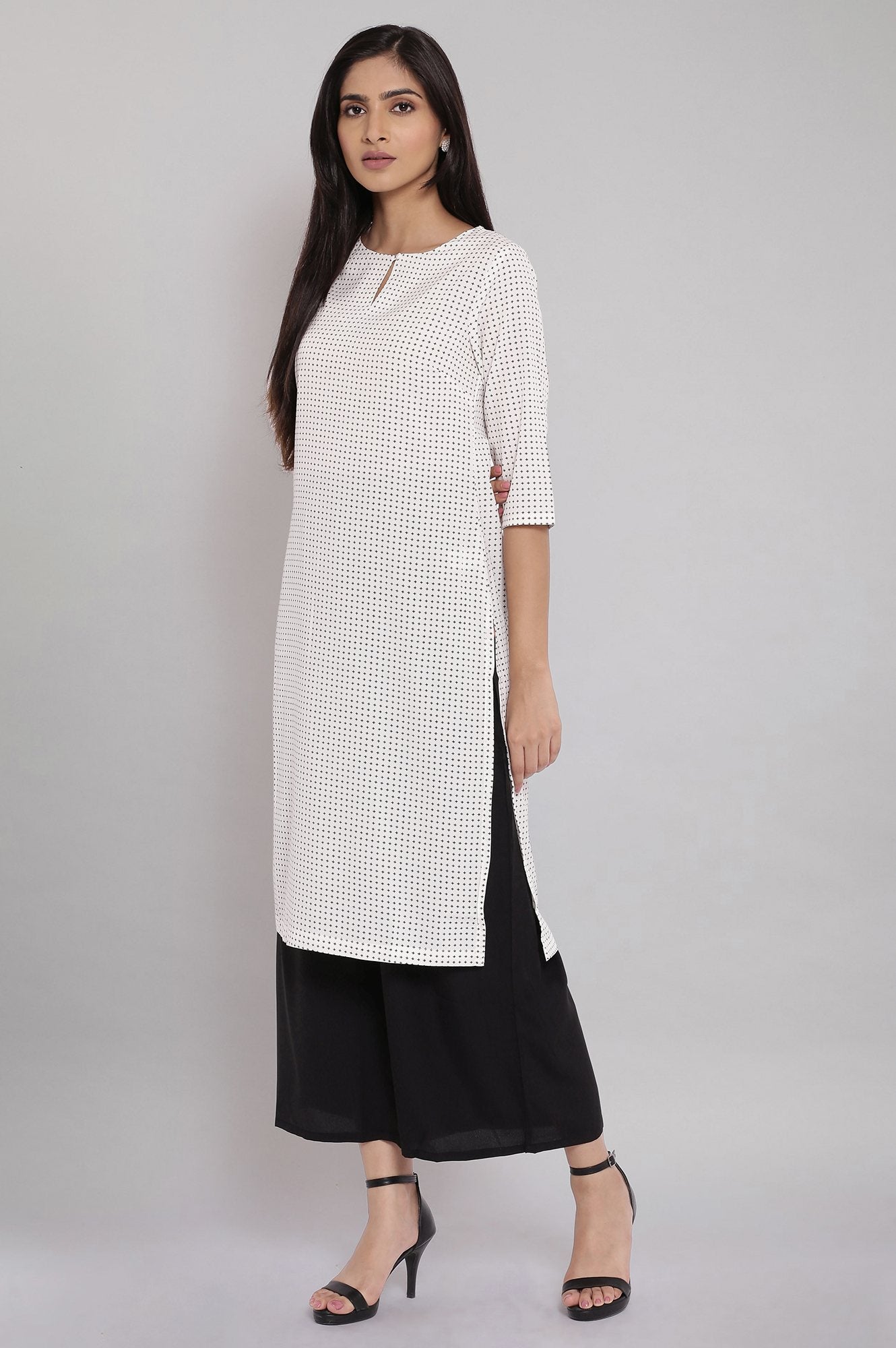 W for Woman Ecru Printed kurta With Black Parallel Pants
