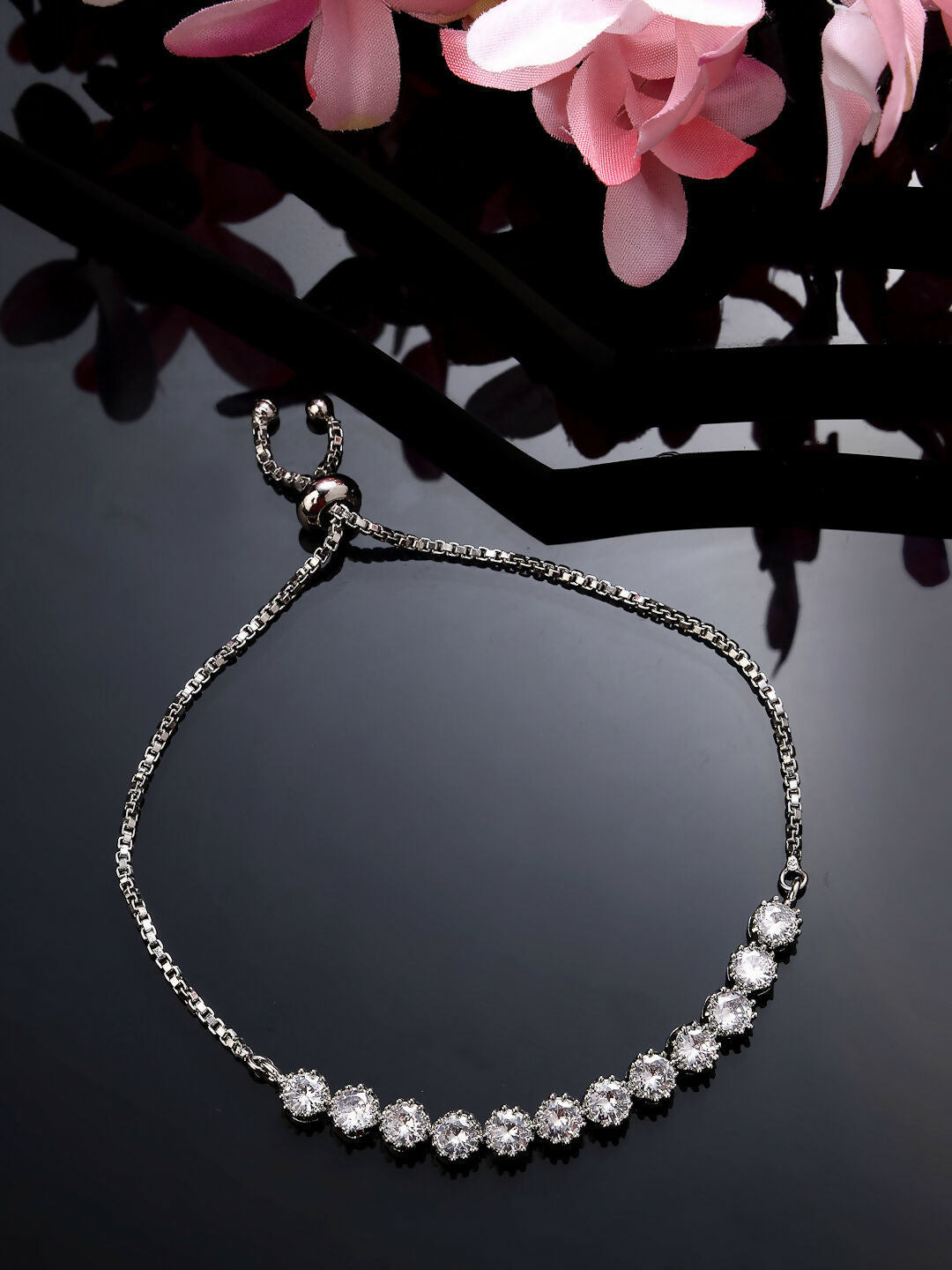 NVR Women Silver-Plated Handcrafted American Diamond Link Bracelet