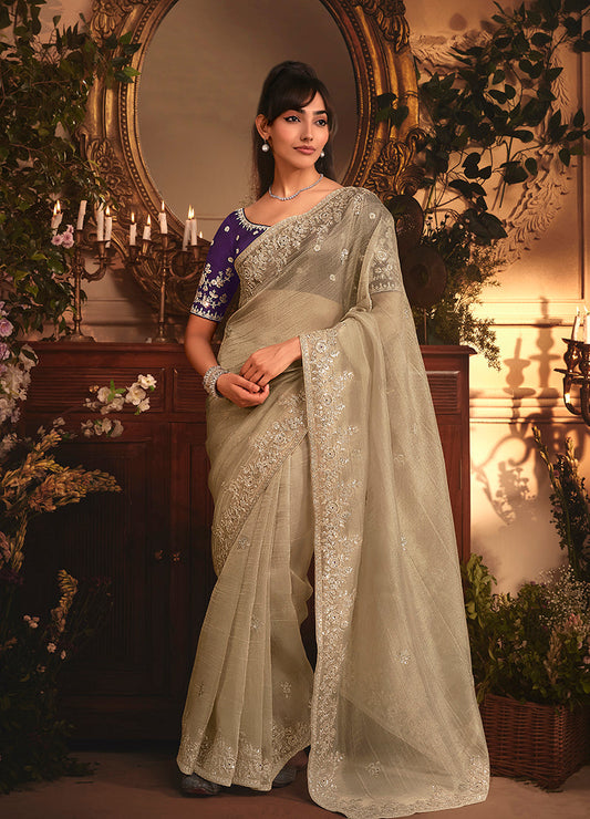 Monjolika Fashion Designer Beige Tissue Organza Saree With All Over Butta Work & Heavy Stone Embellished Border