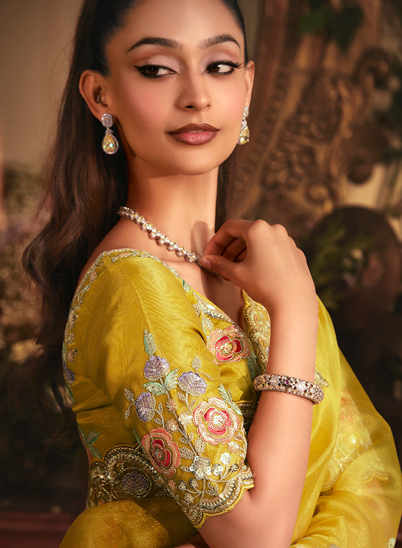 Monjolika Fashion Designer Mustard Tissue Organza Saree With All Over Butta Work & Heavy Stone Embellished Border