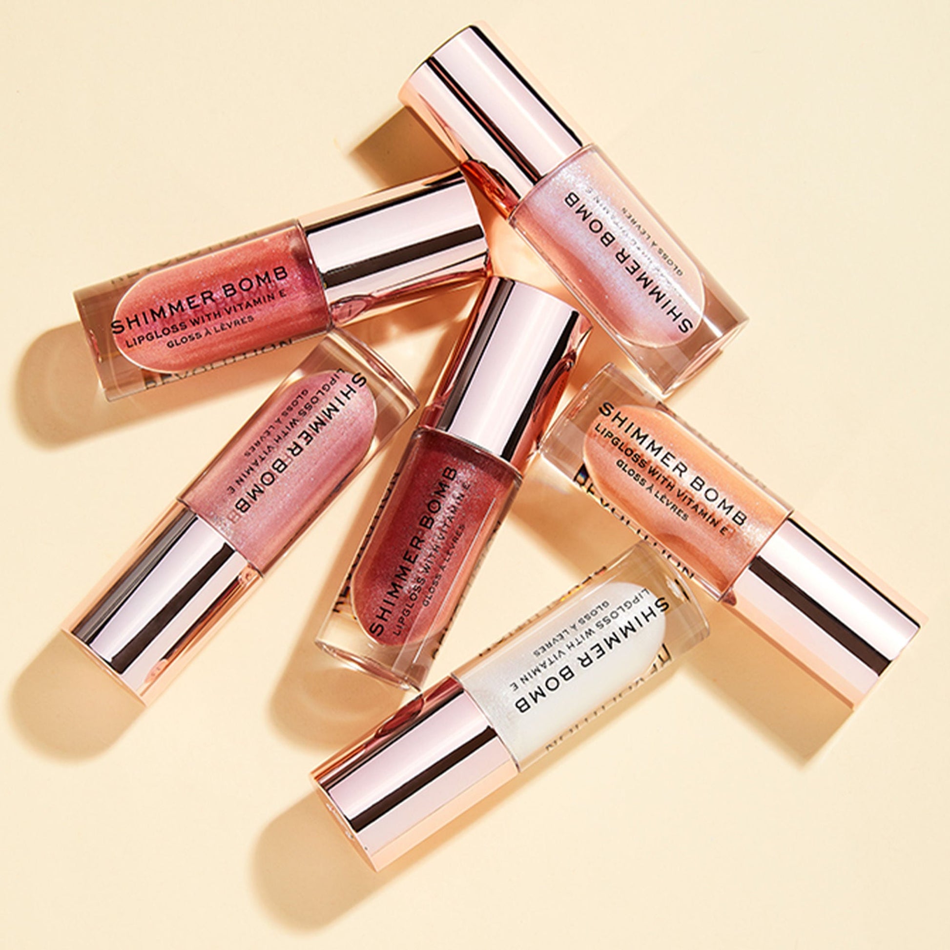 Makeup Revolution Shimmer Bomb Lip Gloss Infused With Vitamin E For Extra Nourishment - Glimmer Nude