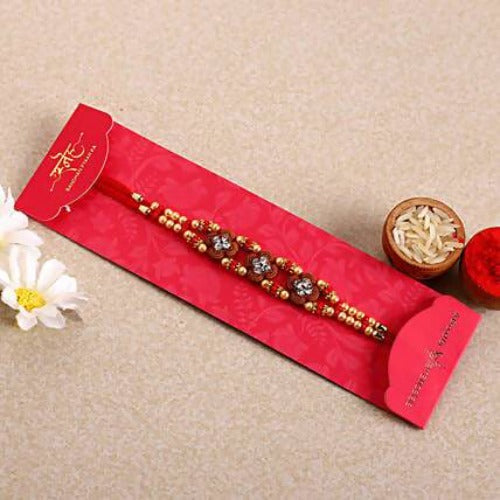 Ethnic American Diamond Rakhi and Cashew Jar Combo