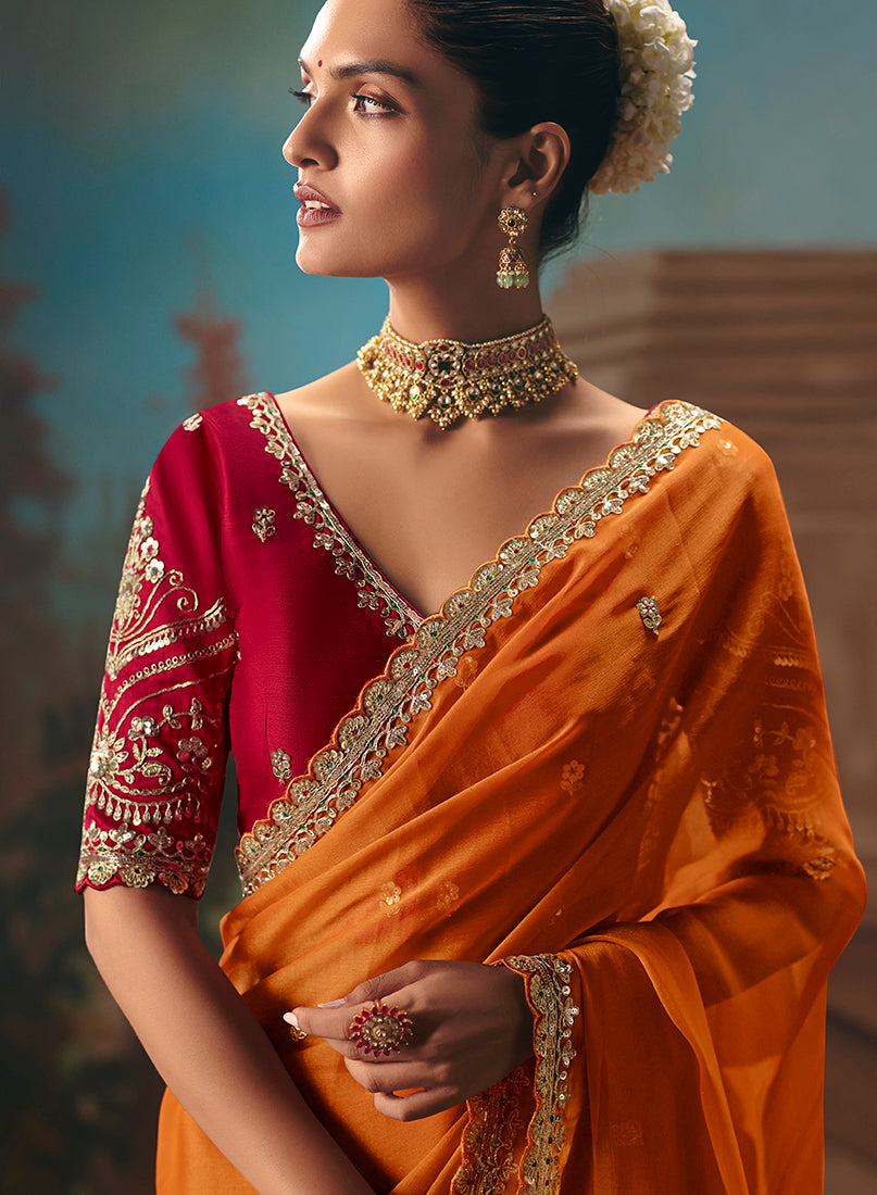 Monjolika Fashion Orange Fancy Fabric Saree With Embroidered Work