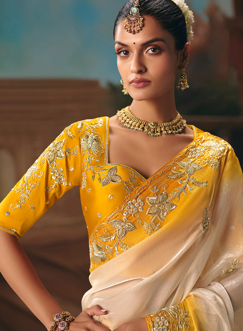 Monjolika Fashion Cream Fancy Fabric Saree With Embroidered Work