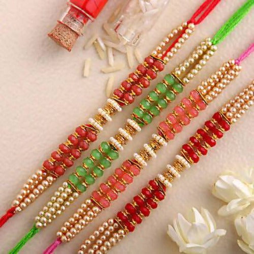 Set of 4 Pretty Pearls Rakhi and Fruit N Nut Chocolates