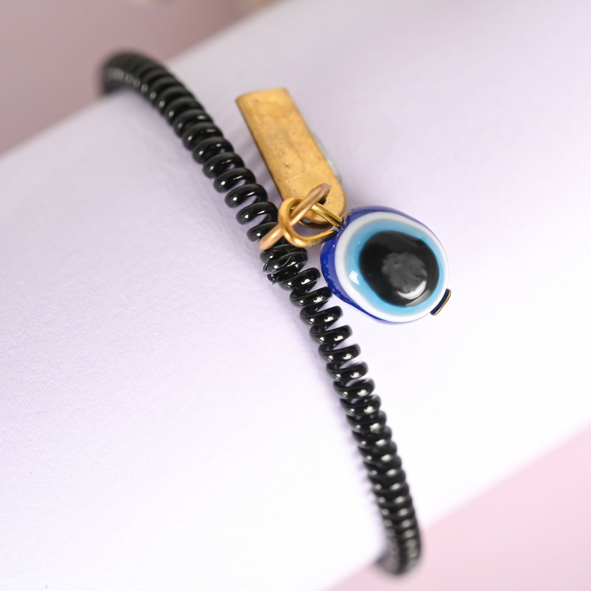 NVR Men & Women Black Evil Eye Crystal Spring Ring Bracelet | Grab2Buy