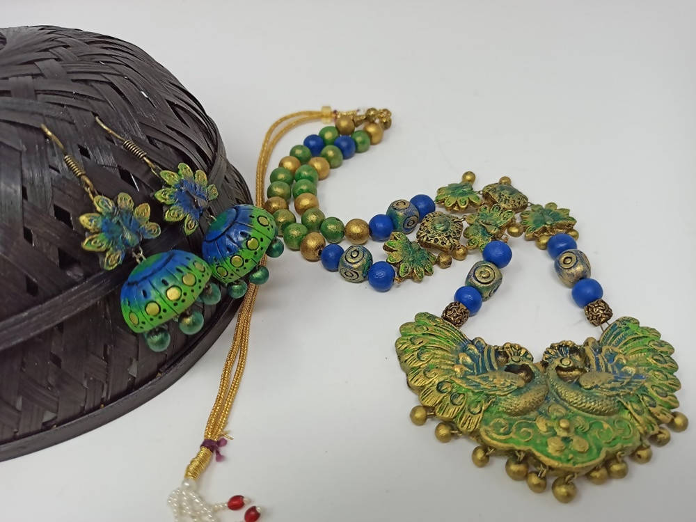 Terracotta Long Haram Set-Beautiful Dazzling Peacock Pendent With Ear Hanging Jhumkas