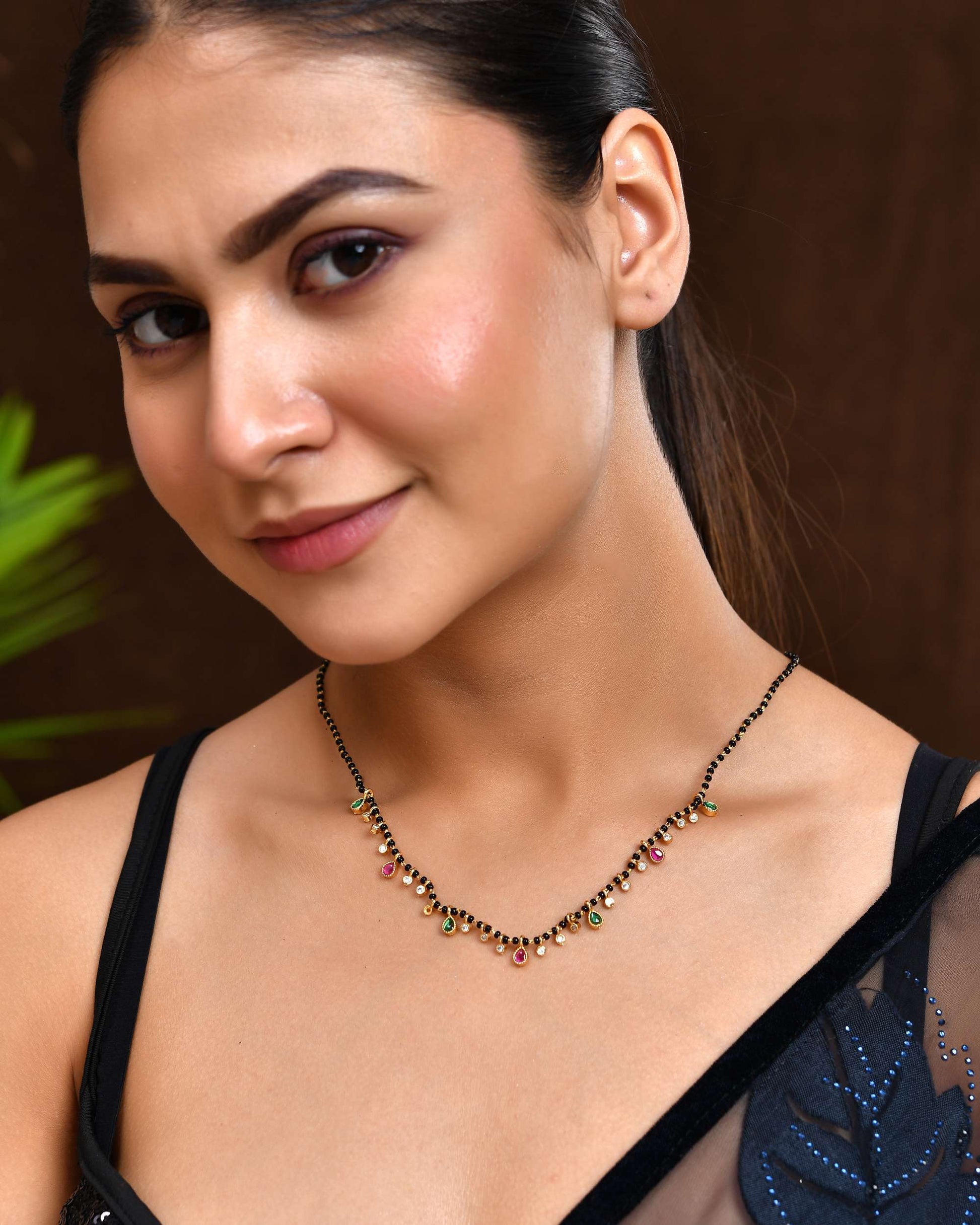 Jewels Nest Elegant Black Beads Mangalsutra with Green & Red Stone Drops – Silver Finish 