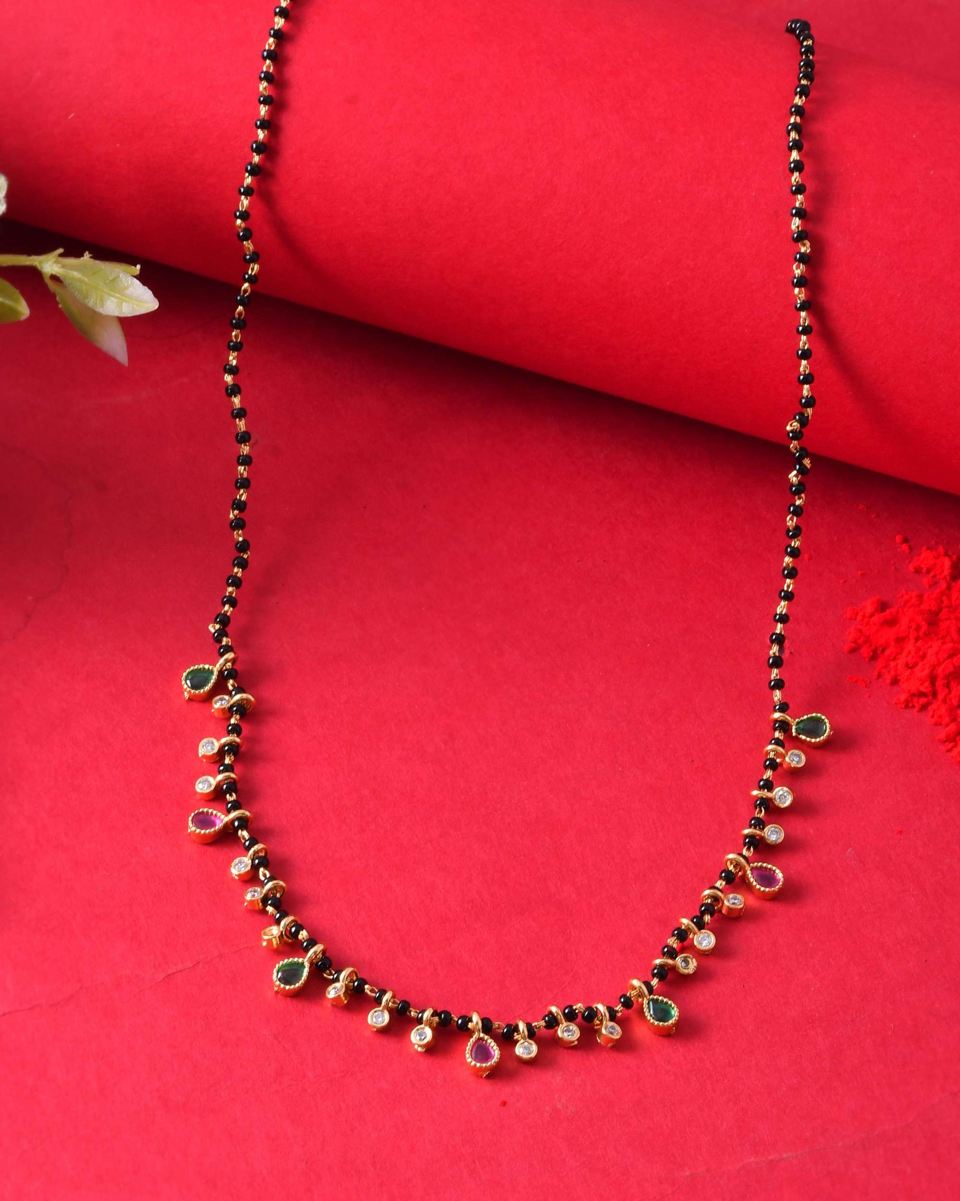 Jewels Nest Elegant Black Beads Mangalsutra with Green & Red Stone Drops – Silver Finish 