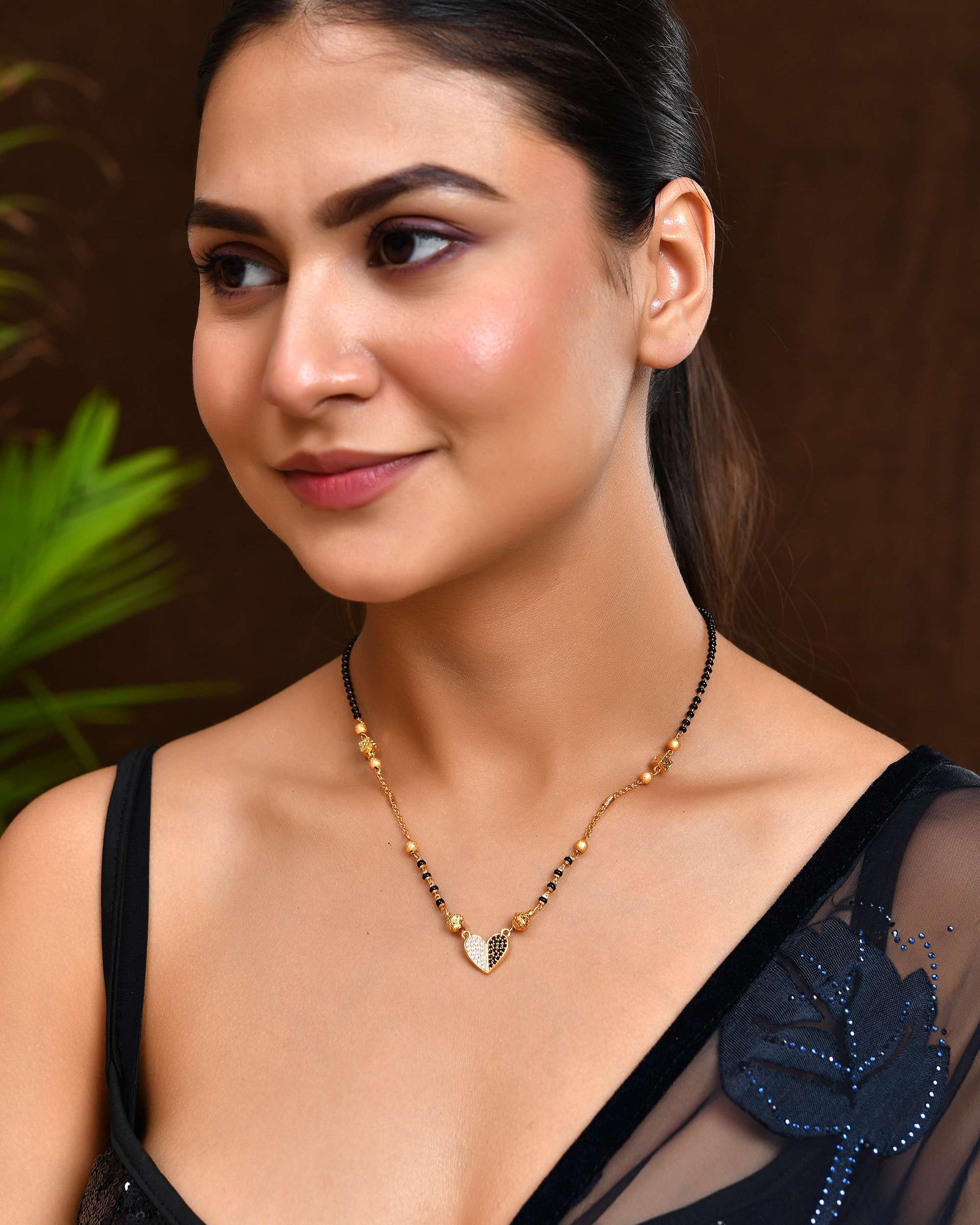 Jewels Nest Dual-Toned Artificial Stone Heart Mangalsutra with Golden Beads 