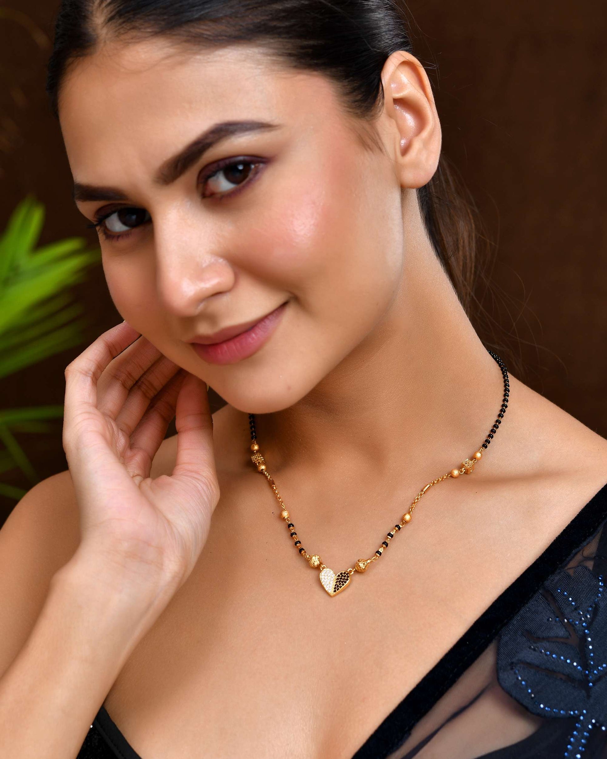 Jewels Nest Dual-Toned Artificial Stone Heart Mangalsutra with Golden Beads 