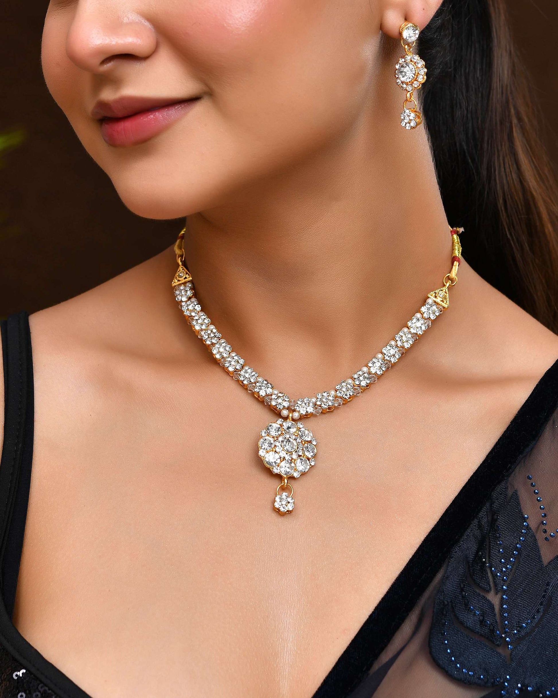 Jewels Nest Glamorous Gold-Plated Crystal Bridal Necklace Set with Earrings & Maang Tikka Jewels Nest