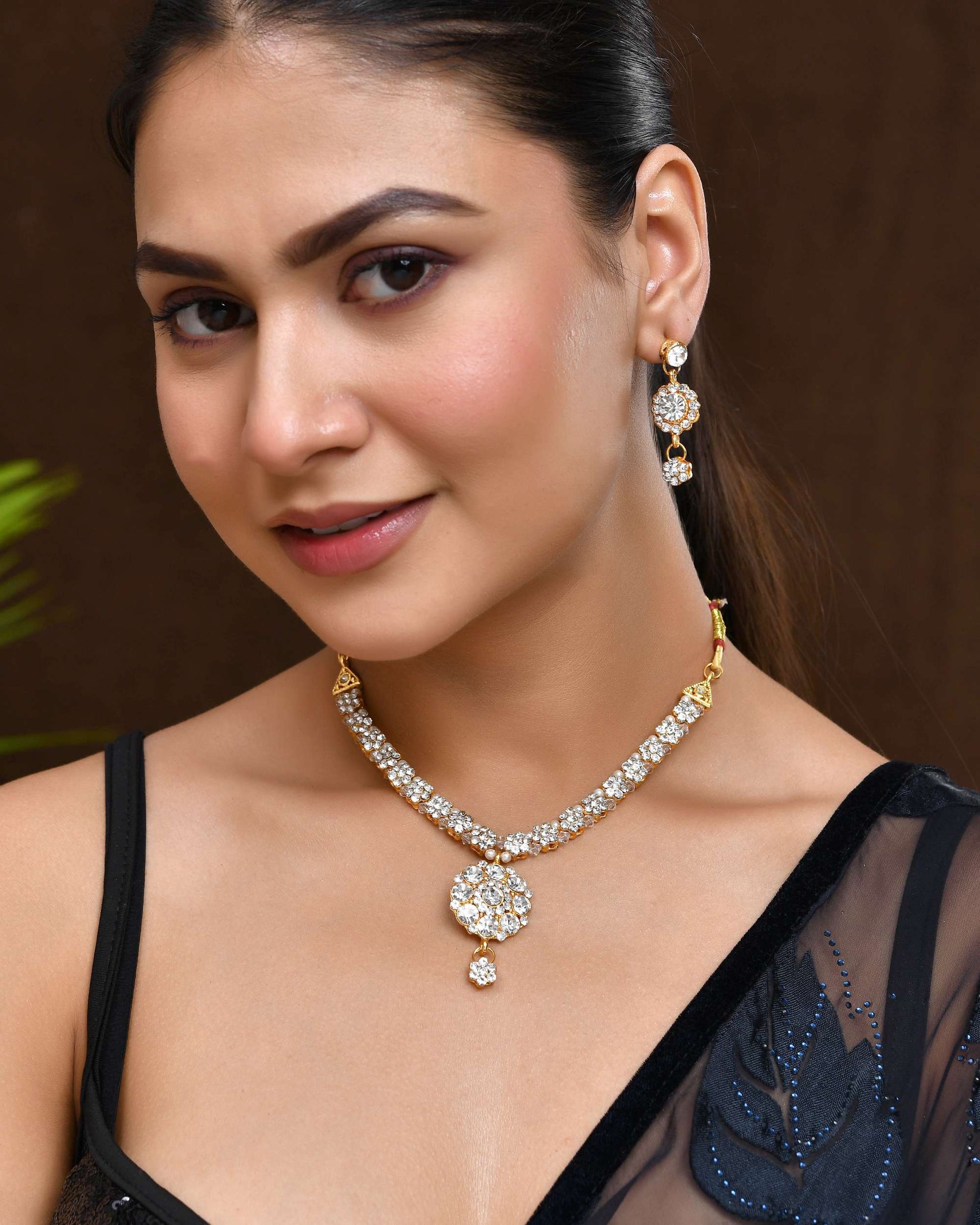 Jewels Nest Glamorous Gold-Plated Crystal Bridal Necklace Set with Earrings & Maang Tikka Jewels Nest