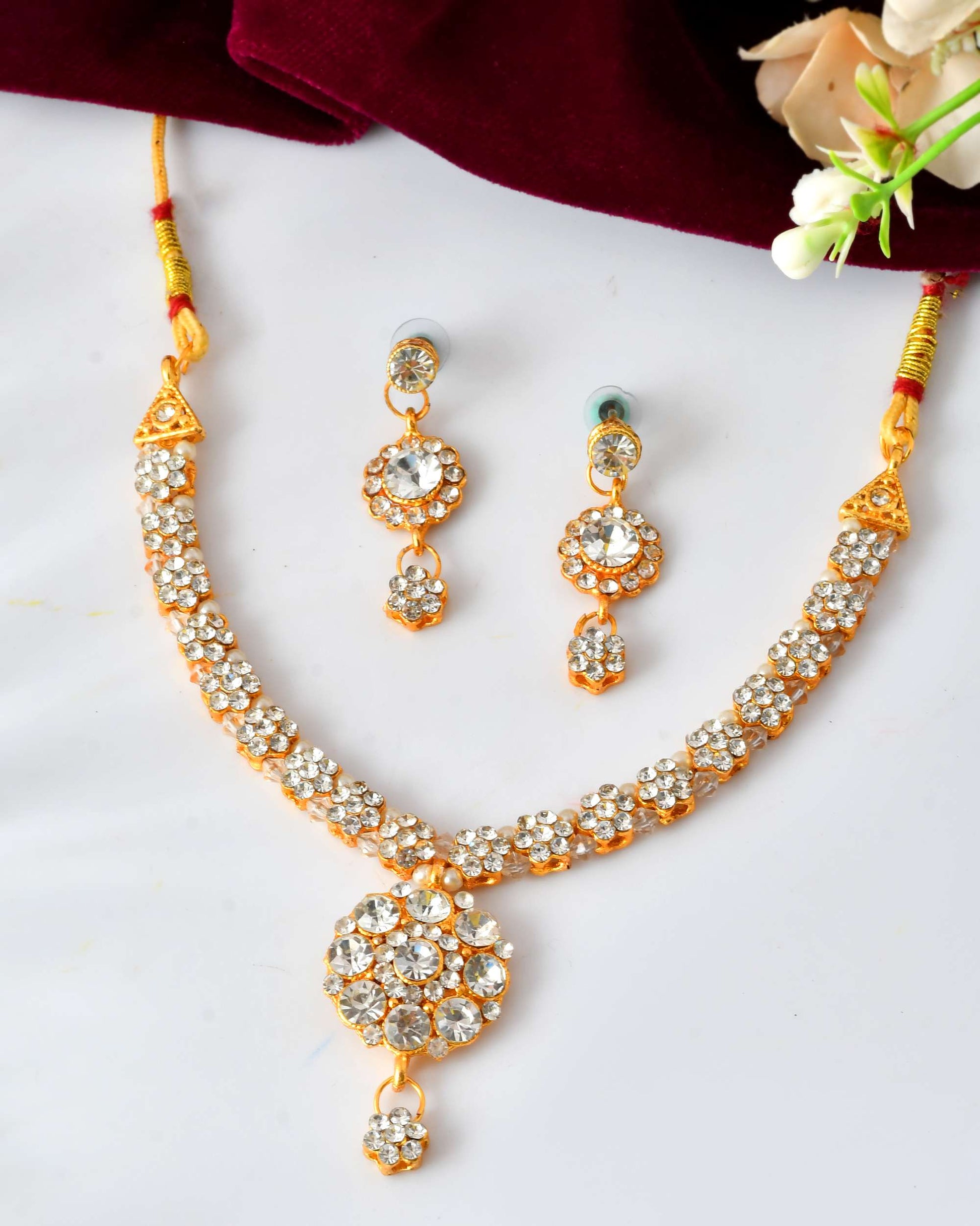 Jewels Nest Glamorous Gold-Plated Crystal Bridal Necklace Set with Earrings & Maang Tikka Jewels Nest