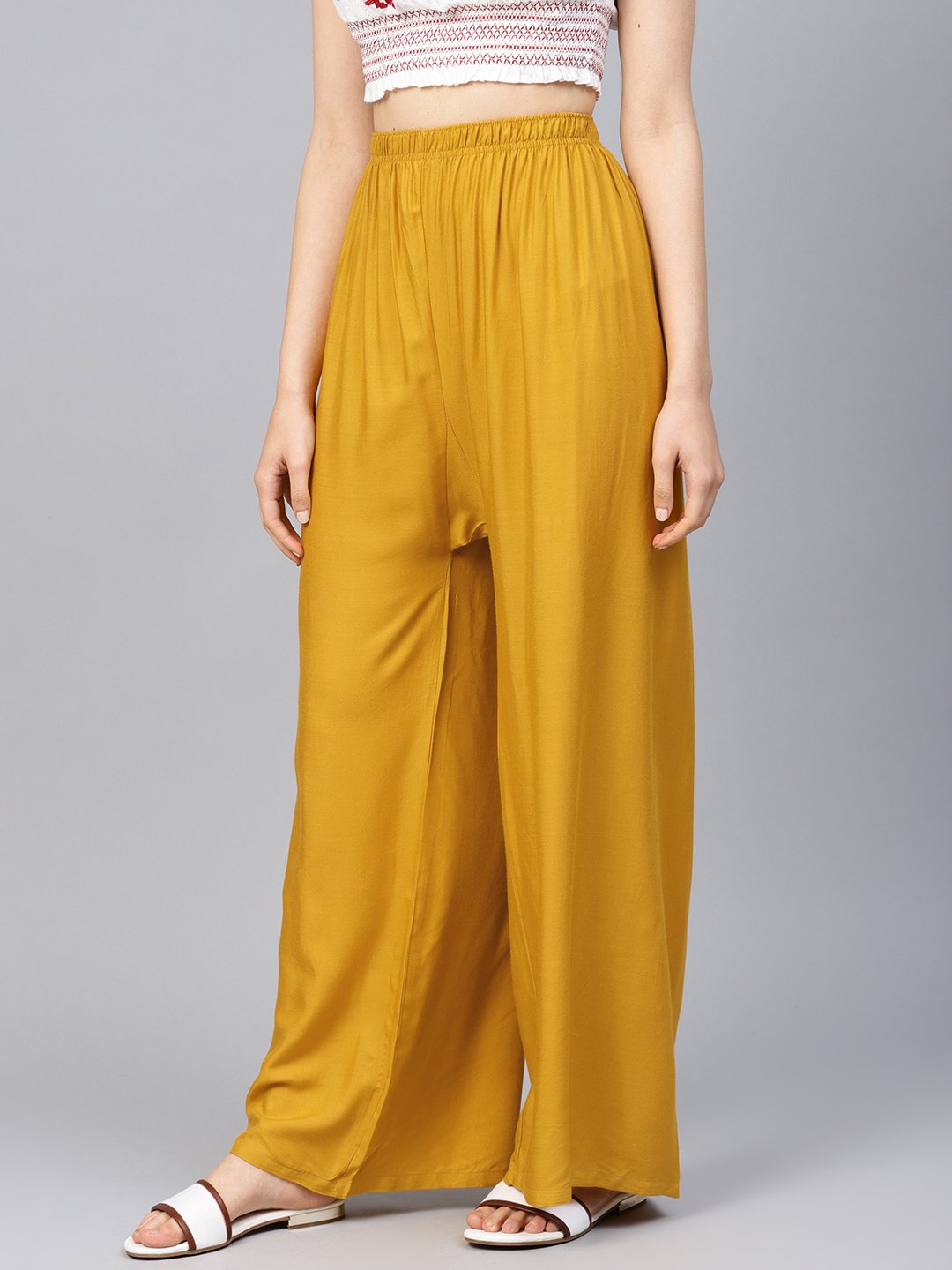 Jompers Women Mustard Solid Straight Palazzos