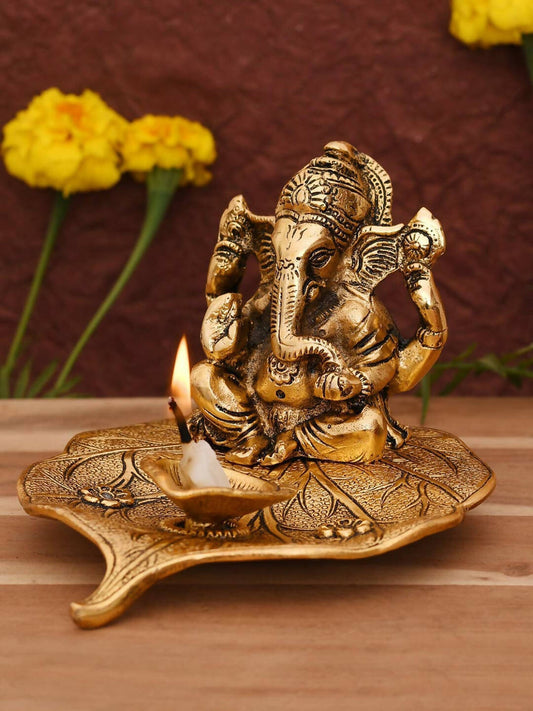 CraftVatika Gold Toned Aluminium Ganesh with Diya Idol 