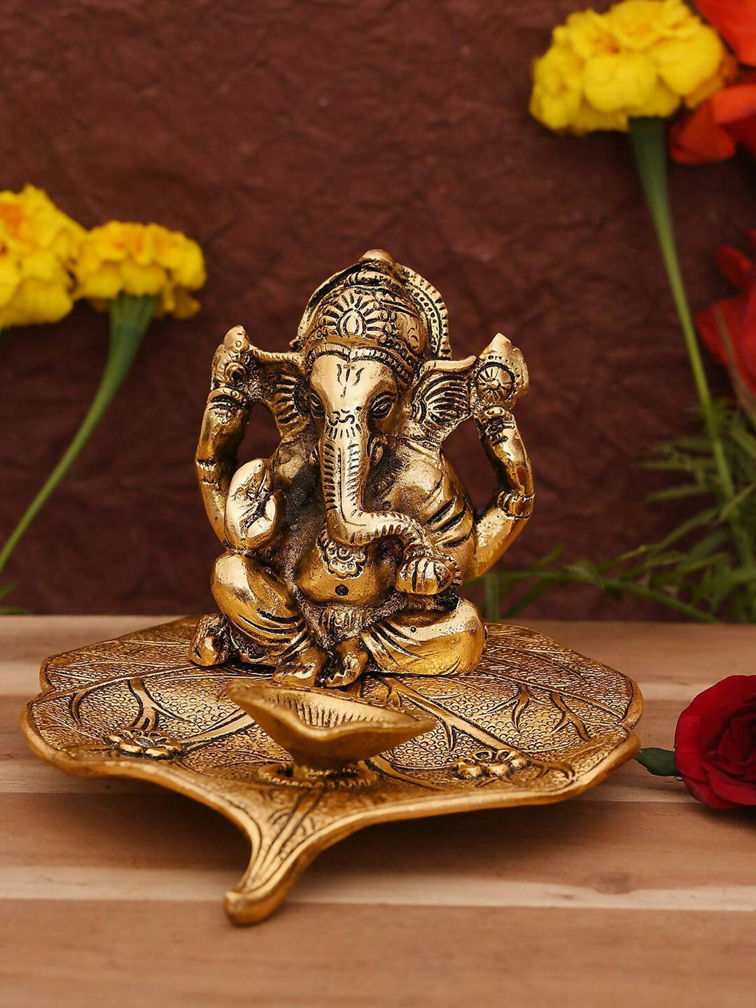 CraftVatika Gold Toned Aluminium Ganesh with Diya Idol 