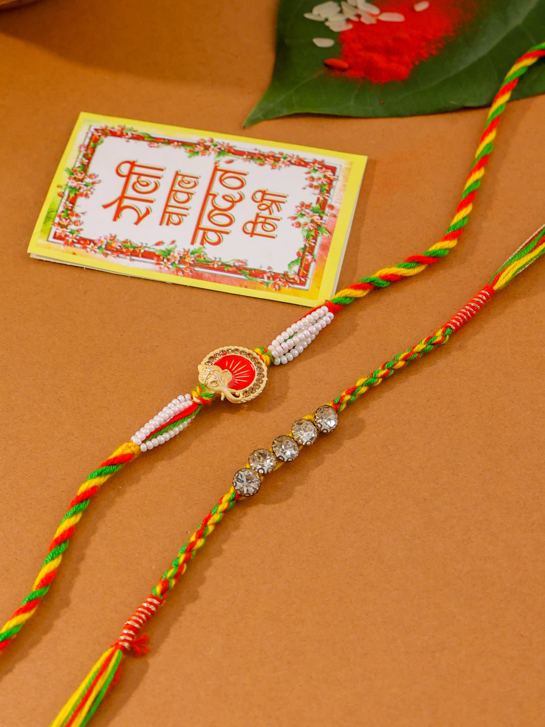 NVR Men Set of 2 Religious Designer Multicolor Artificial Stones Thread Rakhi with Roli Chawal Chandan & Mishri | Grab2Buy