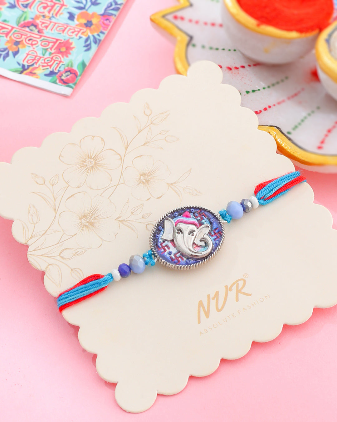 NVR Men Red & Blue Ganesh Ji Thread Rakhi with Roli Chawal Chandan & Mishri | Grab2Buy