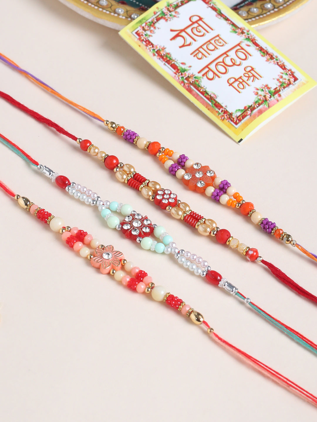 NVR Men Set of 4 Floral Design Multicolor Artificial Stones and Beads Thread Rakhi with Roli Chawal Chandan & Mishri | Grab2Buy