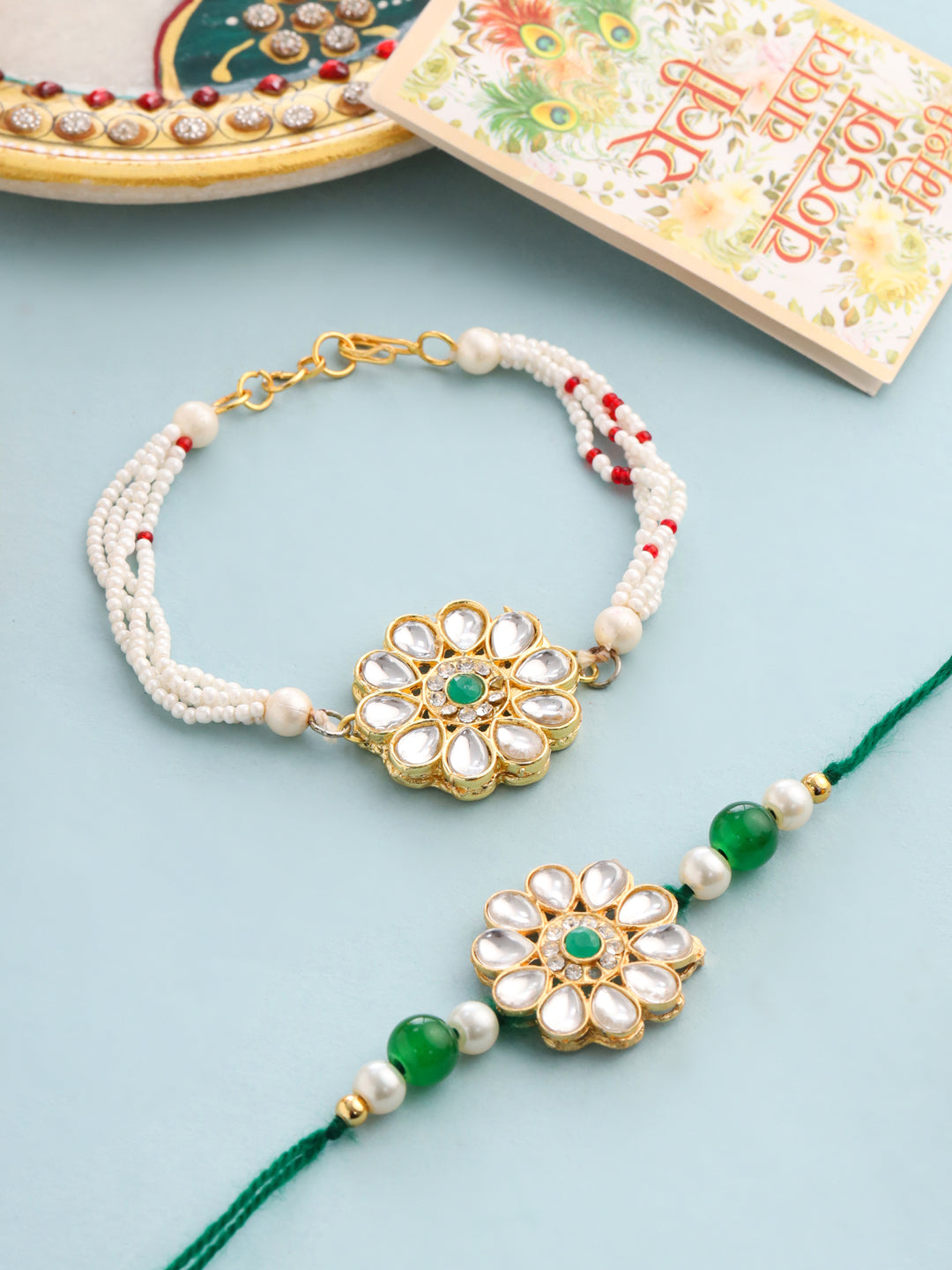 NVR Set of 2 Kundan Studded Floral Design Gold Toned Bhaiya Bhabhi Rakhi Set with Roli Chawal Chandan & Mishri | Grab2Buy