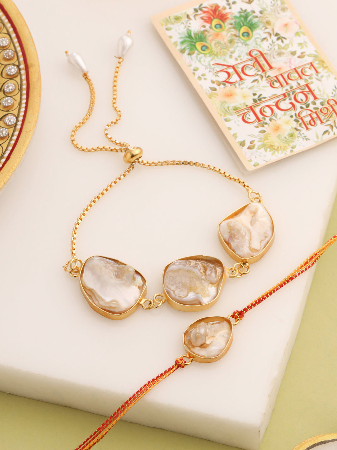 NVR Set of 2 Gold Toned Pearls Bhaiya Bhabhi Rakhi with Roli Chawal Chandan & Mishri | Grab2Buy