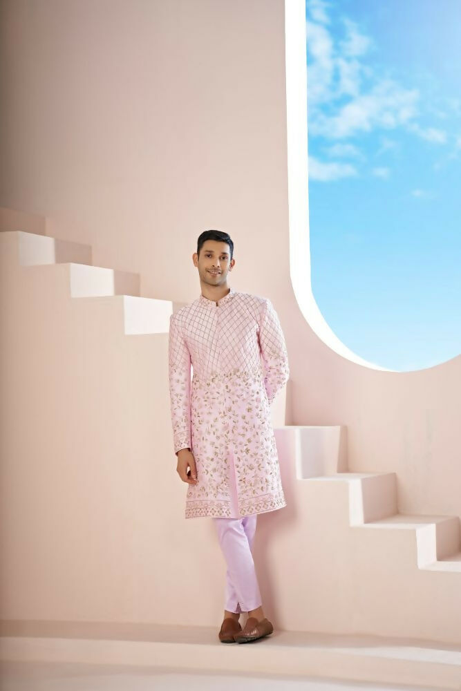 A Pink Sherwani Featuring Elegant Cross-Line Patterns Adorned With Intricate Floral Designs by Hilo Design 