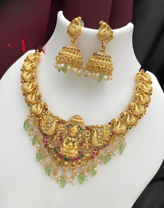 Jewel City Opulent Gold Peacock Lakshmi Temple Necklace Set - Handcrafted Antique Finish Bridal Jewelry with Emerald & Pearl Accent | Swadesiicart