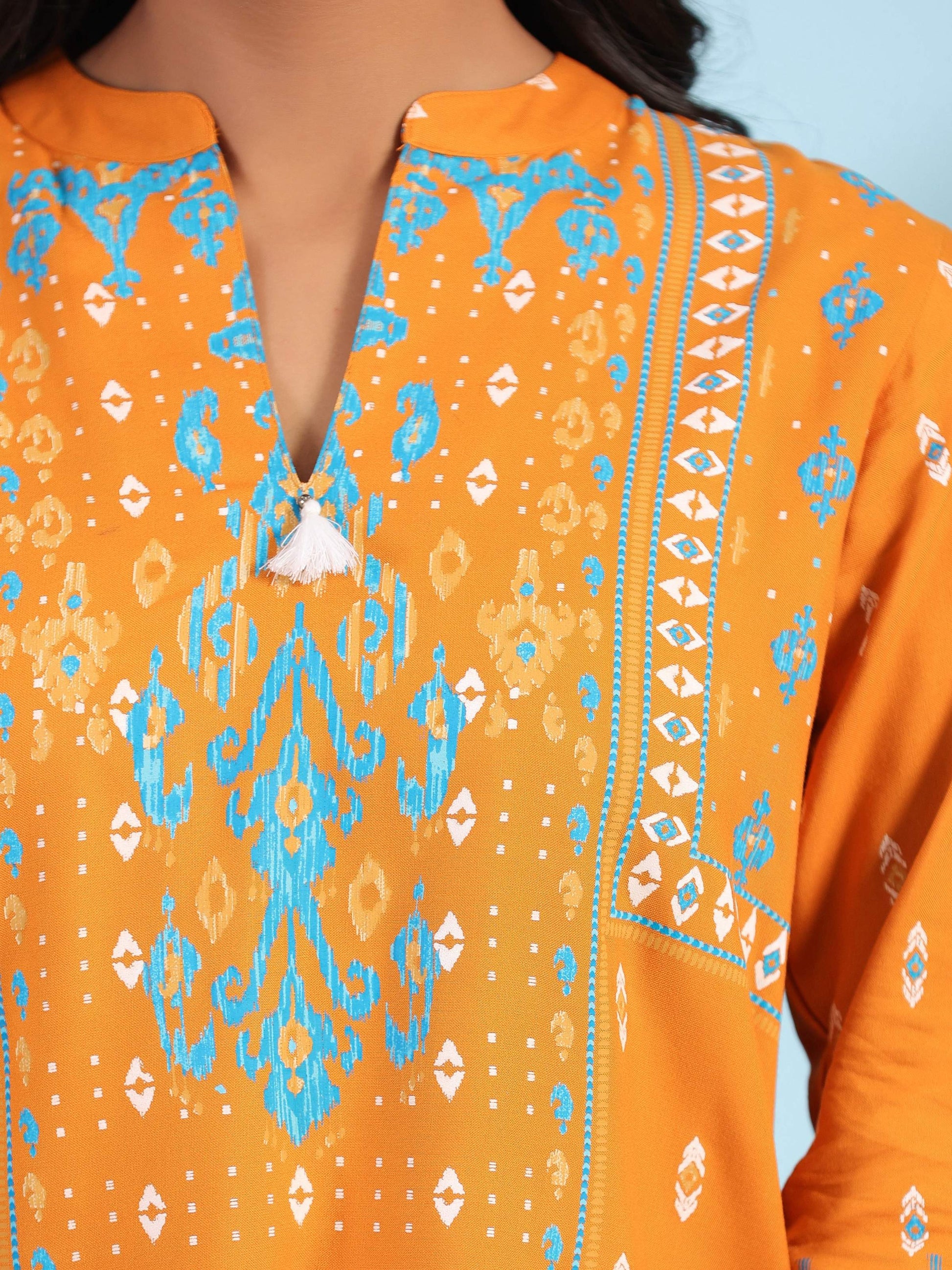 Juniper Mustard Rayon Ikat Placement Printed High-Low Tunic With Side Slits & Tassels