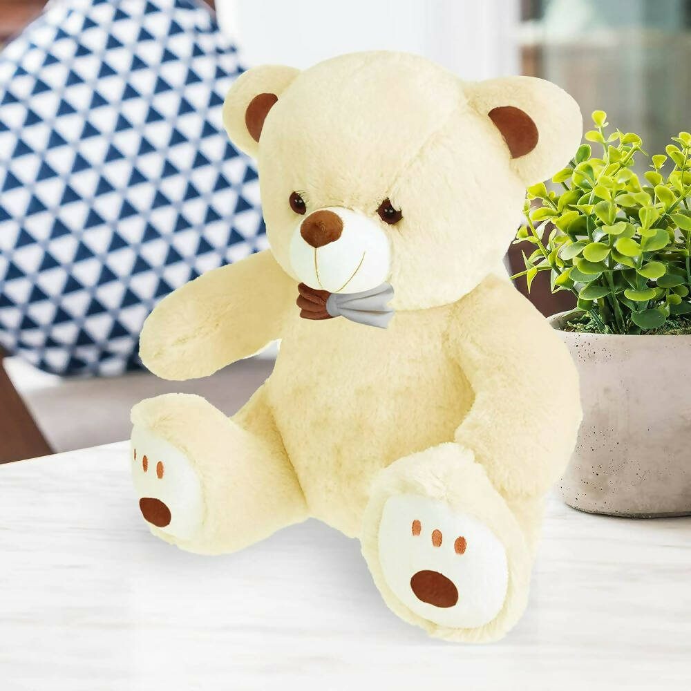 Webby Plush Cute Sitting Teddy Bear Soft Toys with Neck Bow and Foot Print (Beige)  Grab2Buy Generic Grab2Buy