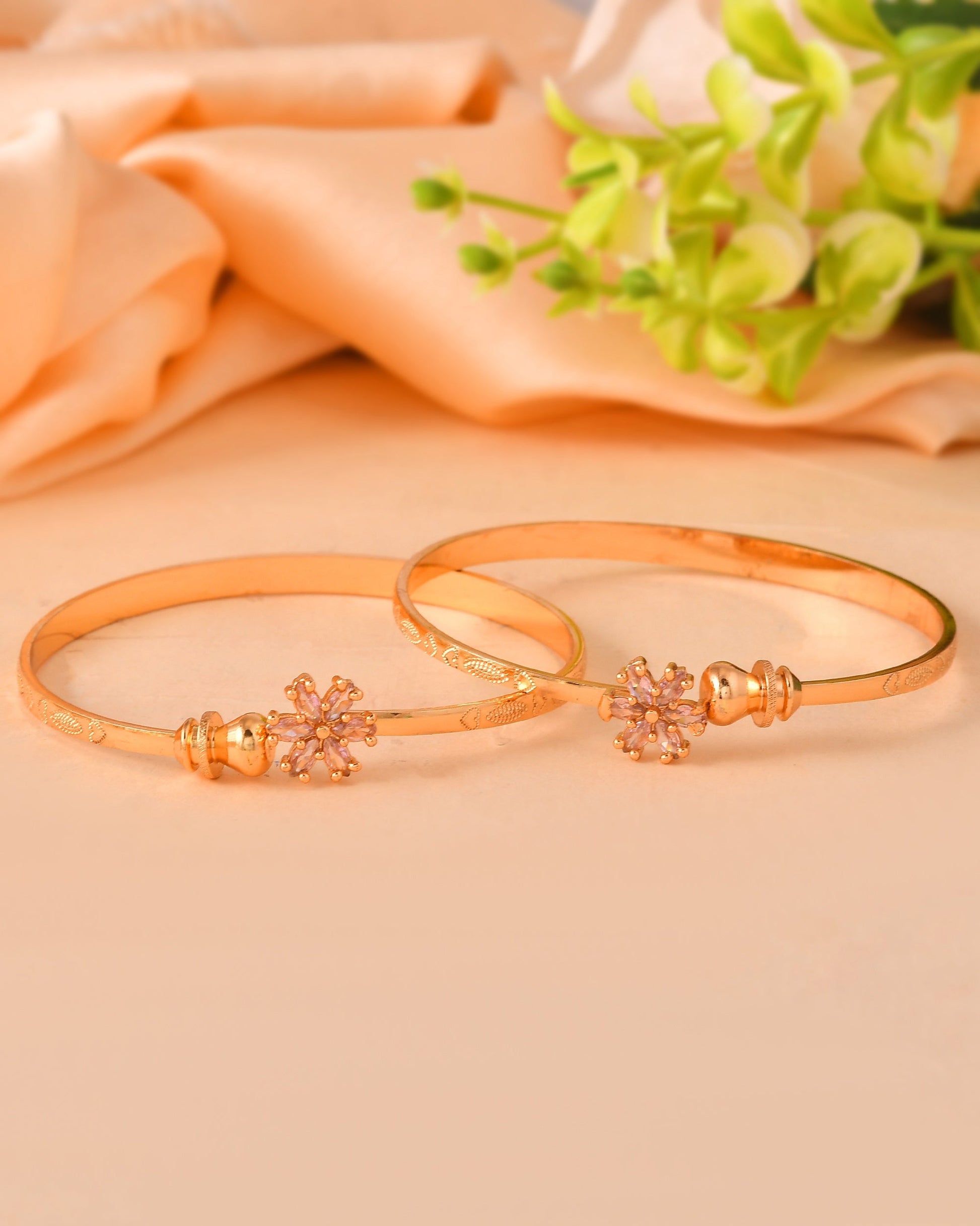 VOJ Set Of 2 Gold Polished Pink Stone Studded Floral Shaped Bangles 