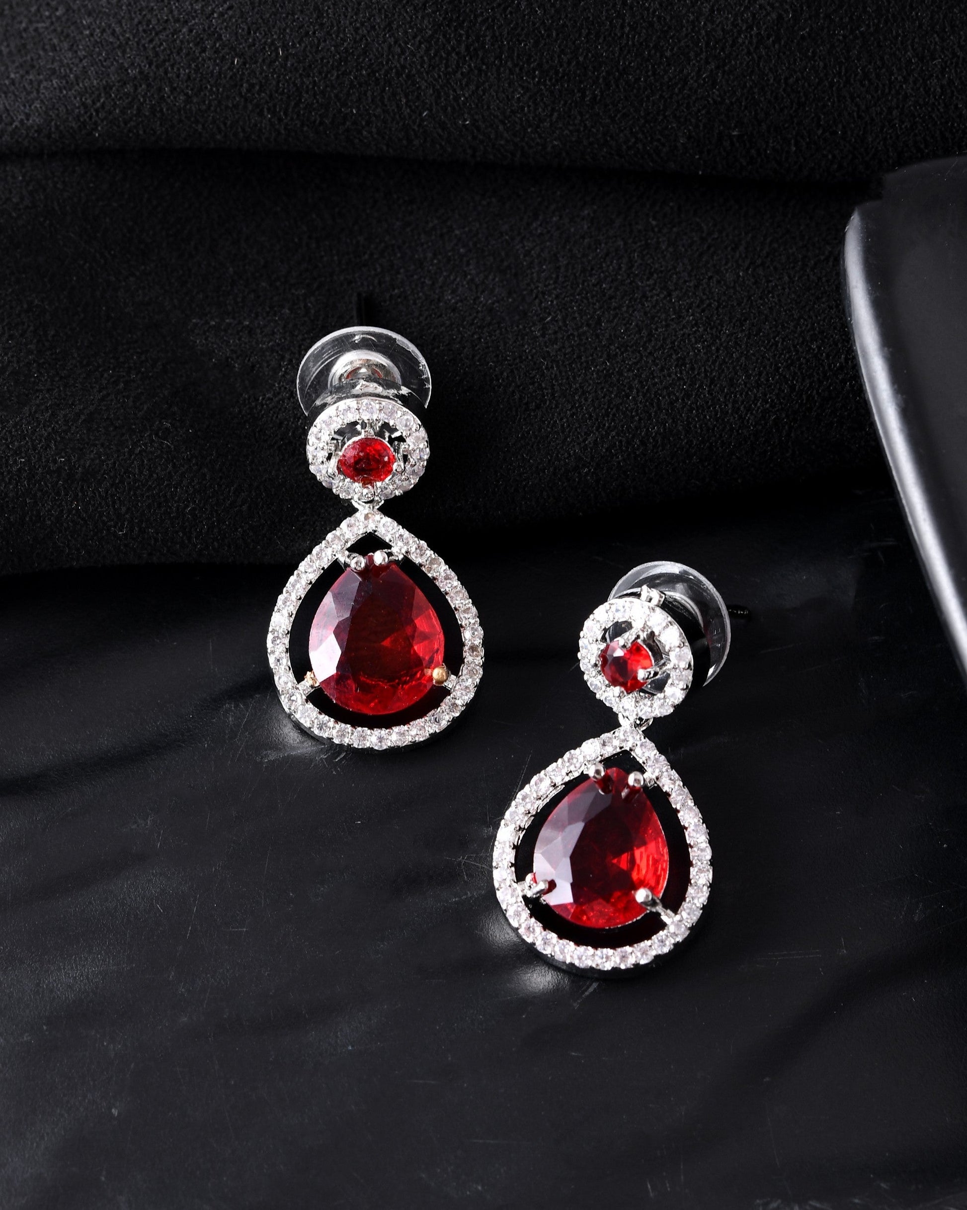 VOJ Silver Plated Red Stone Studded Teardrop Shaped Earrings 