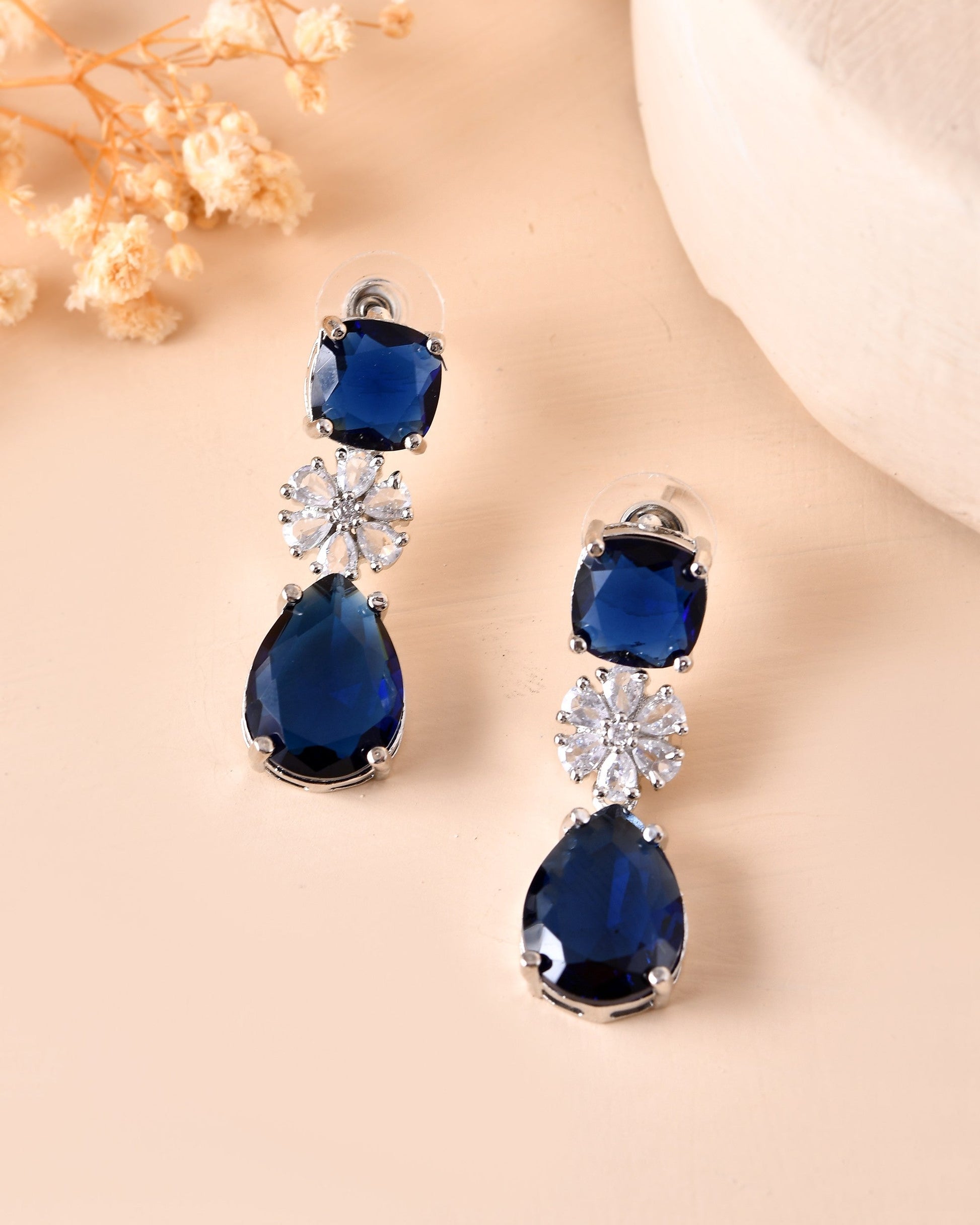 VOJ Silver Plated Blue Stone Studded Floral Shaped Studs Earrings 