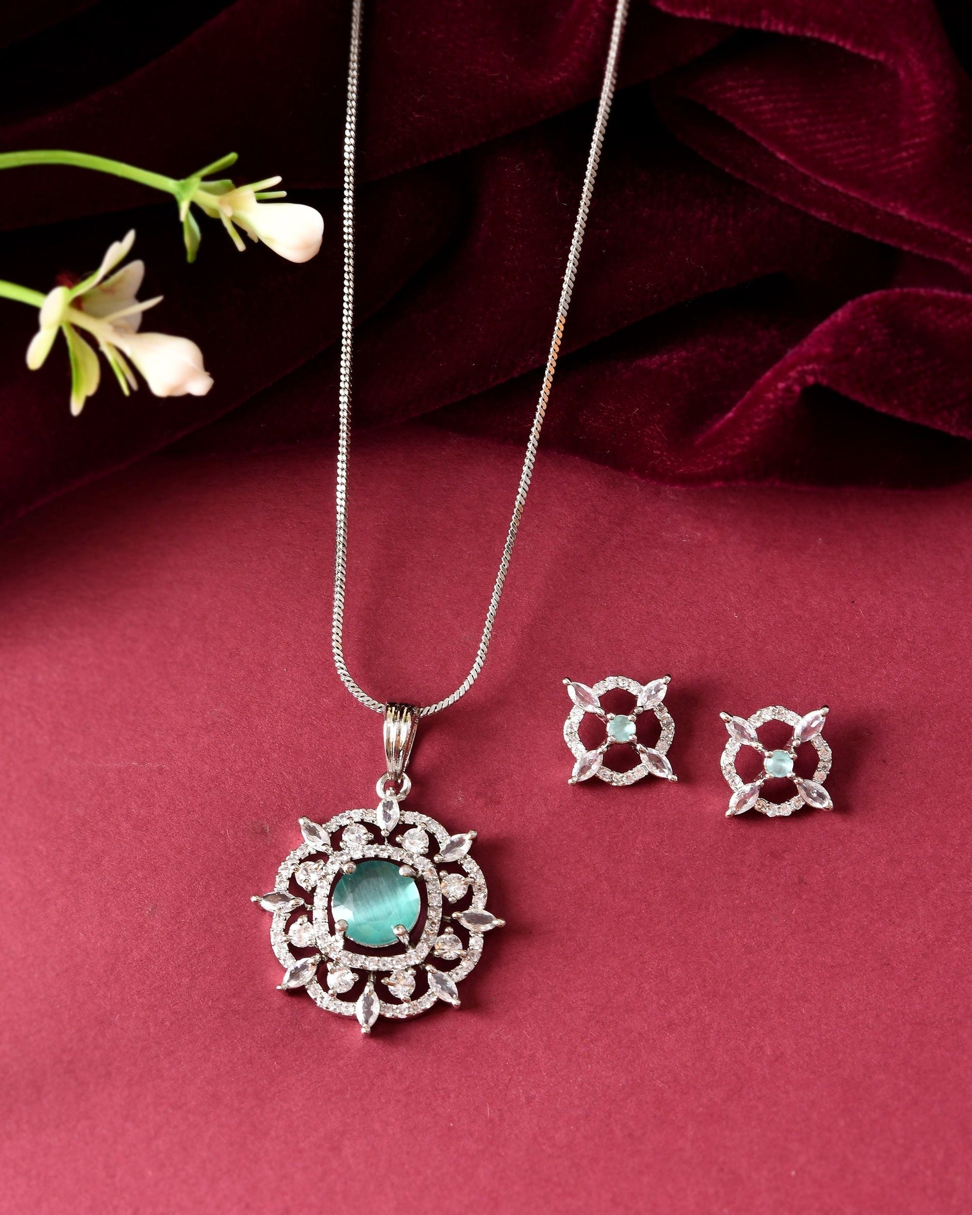 VOJ Silver Plated Sea Green Circulare Stone Studded Sun Shaped Ad Pendant With Chain Set  Grab2Buy VOJ Grab2Buy