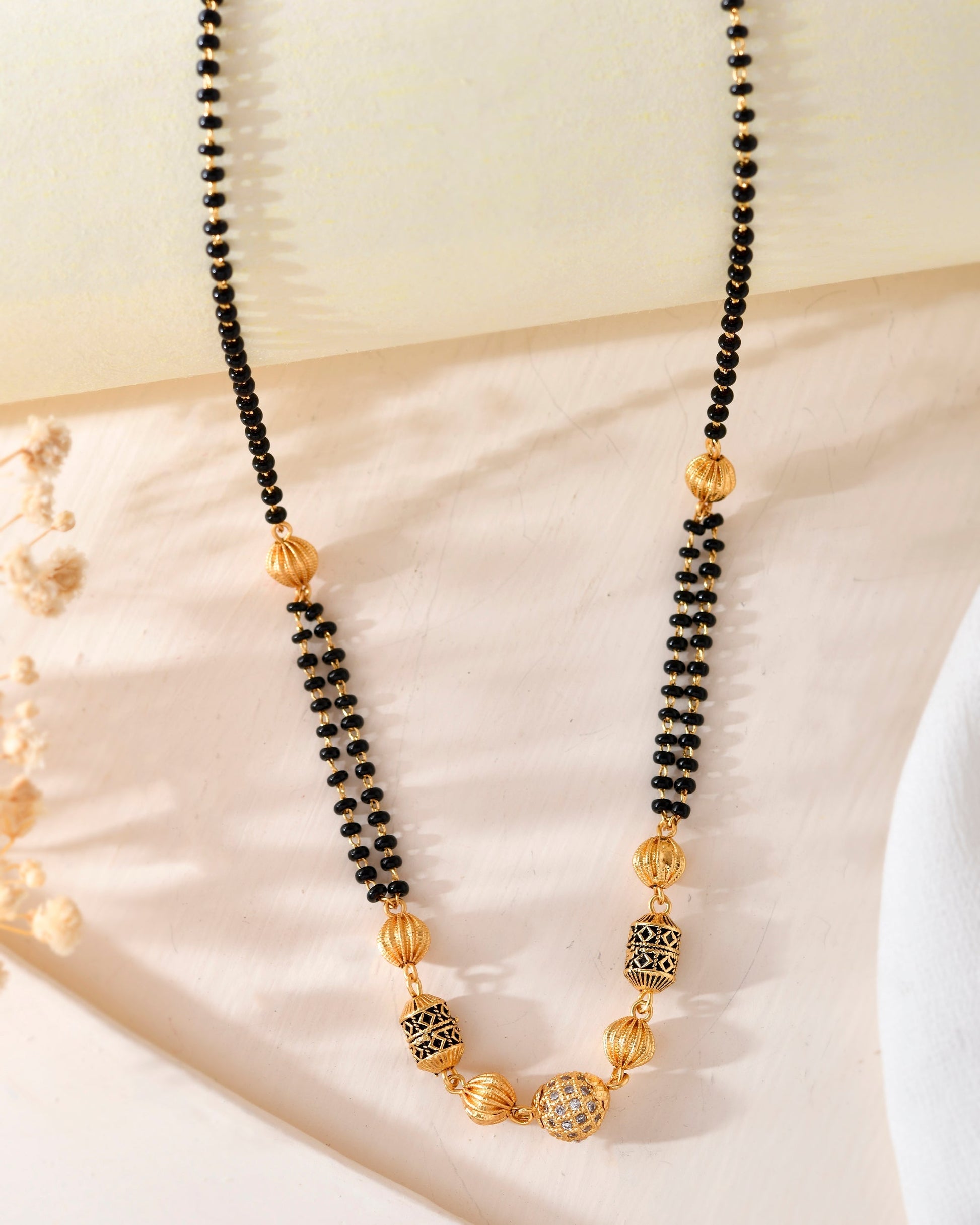 VOJ Gold-Polished Stone Studded Cricular shaped Mangalsutra 